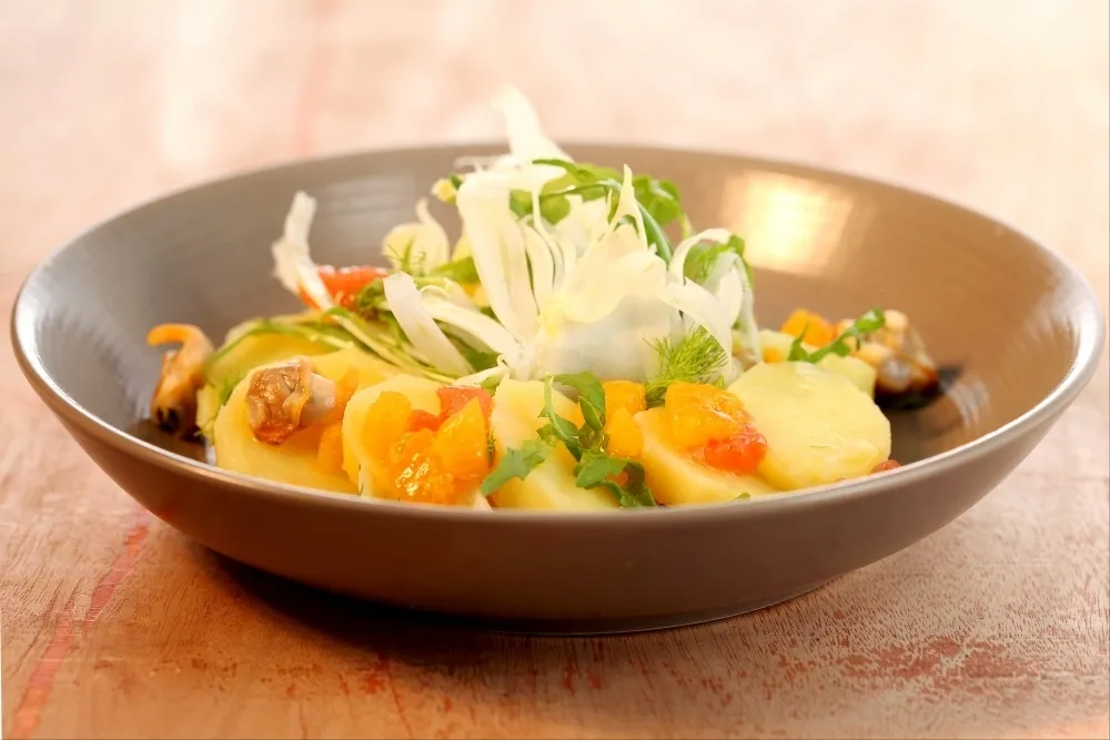 Image recette Salade de pommes de terre primeurs aux coques, vinaigrette aux agrumes
