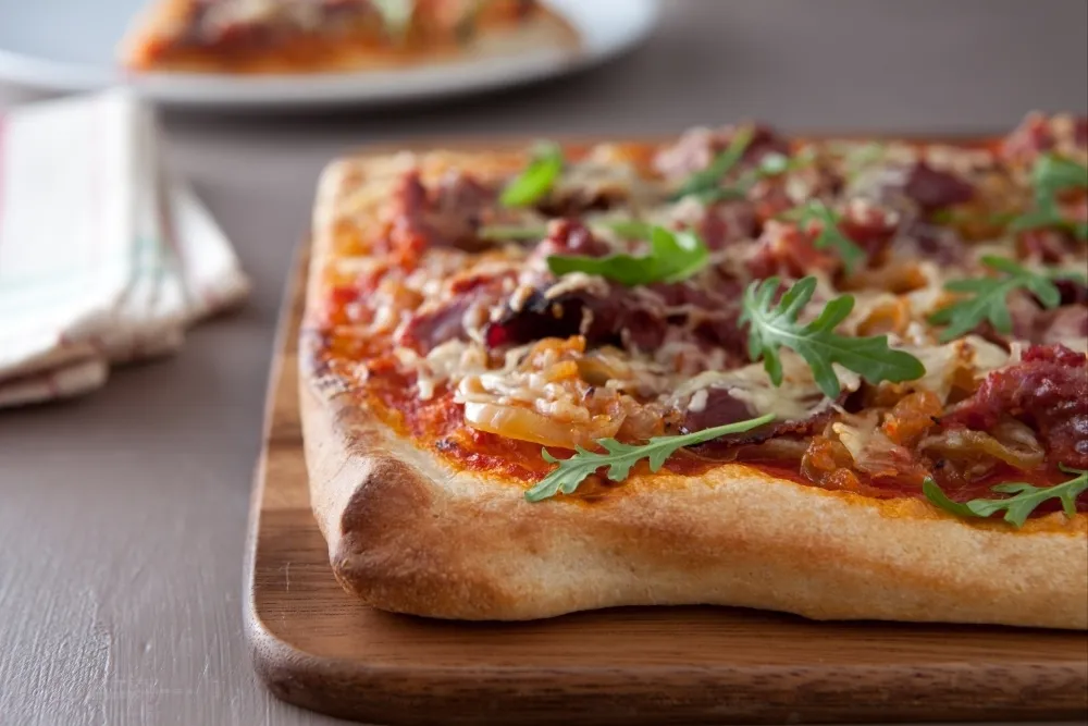 Image recette Pizza au canard et oignons confits